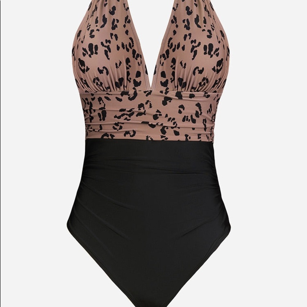 Brand new never worn Shirred Front Plunge Halter One Piece. Too small for me.